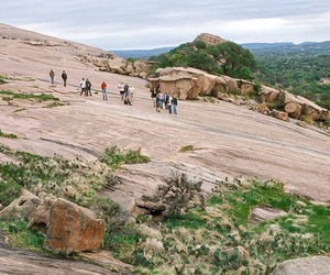 Make it an unforgettable family getaway from Houston  by hiking Enchanted Rock. Photo courtesy Passport to Texas.