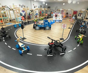 Kids can hop on tricycles and ride around the indoor track at L.I. Salty Kids Cove. Photo by the author 